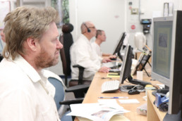 Inmates working on computers at the data entry shop